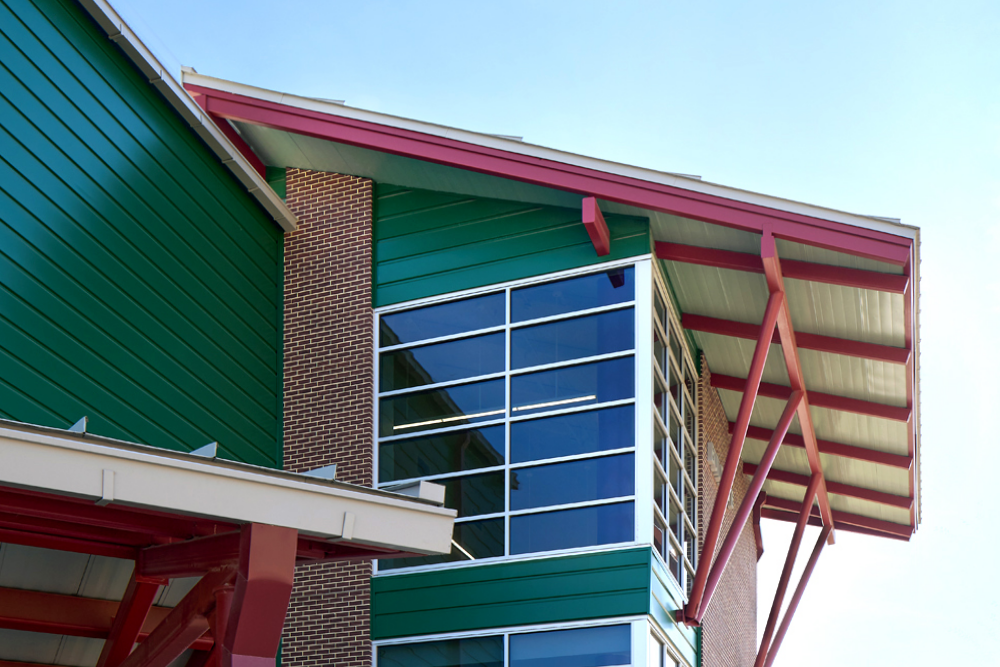 Stair tower with “wing” sunshade reference to the school mascot, the “Kitty Hawk Flyers”.