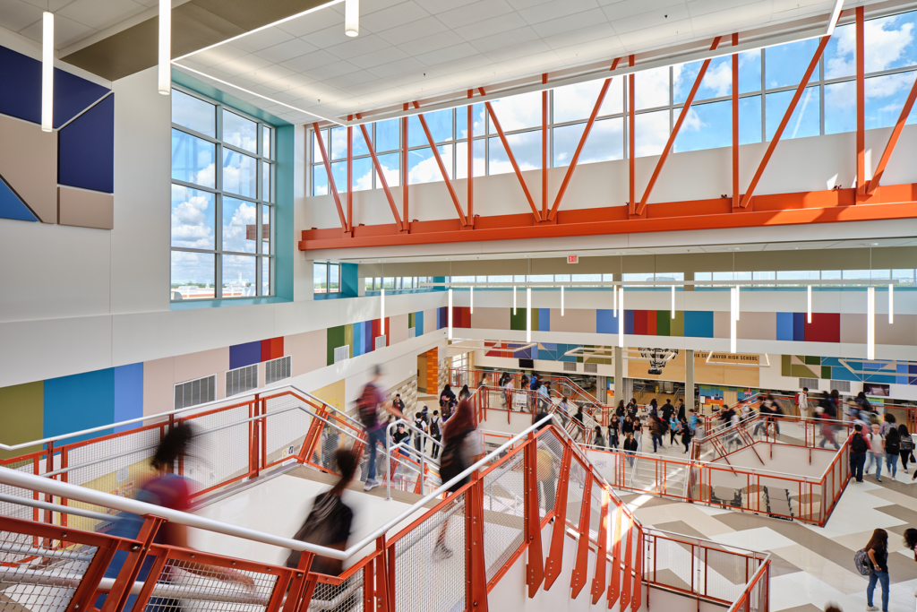 Light-filled, three-story central stair creates visual and literal connections, encouraging social interaction and development.