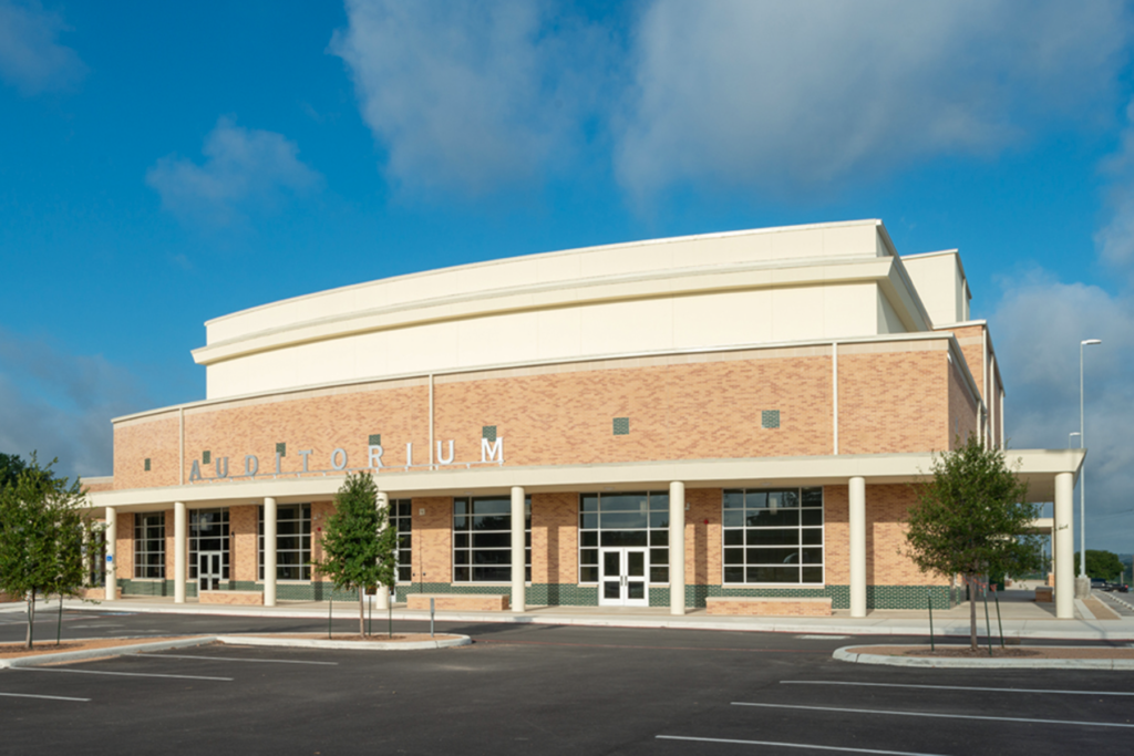 The stepped building façade and colonnade gives a friendly human scale to the entry.
