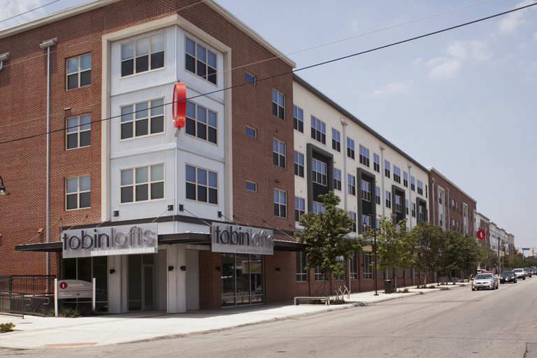 Building façade along Main Street emulates the organic variations of a legacy streetscape and defines a boundary edge of the San Antonio College campus.