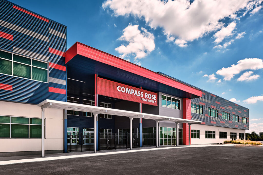 The entrance for Compass Rose Ingenuity High School welcomes students with an enclosed breezeway to protect them from the elements.