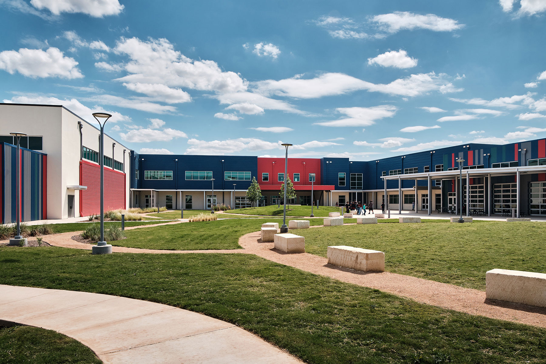 All three phases wrap the courtyard. Pictured here is the multipurpose space and middle school (right), the gym (left), and the high school on the left, and the middle school in the center.